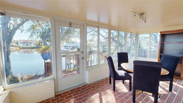 sunroom with a water view