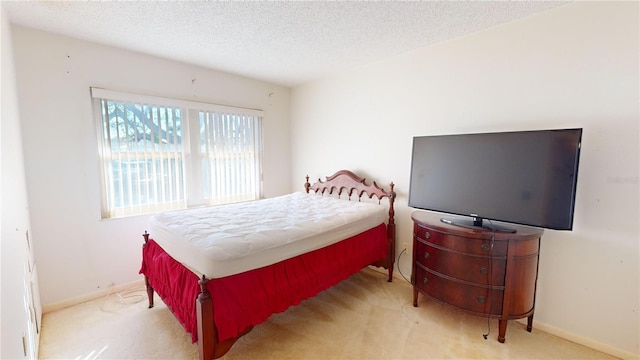 carpeted bedroom with a textured ceiling