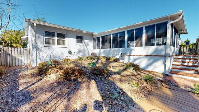 exterior space featuring a deck and a sunroom