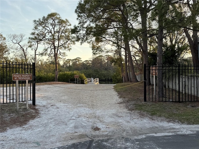 view of gate at dusk