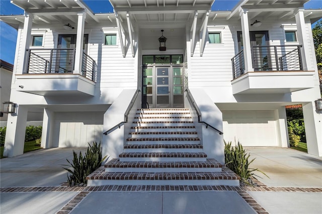 doorway to property with a garage