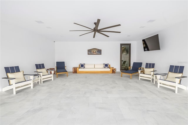 living area featuring ceiling fan