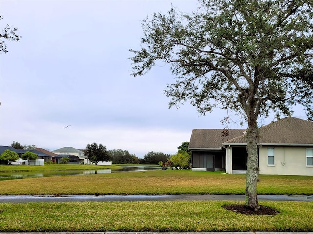 view of yard with a water view