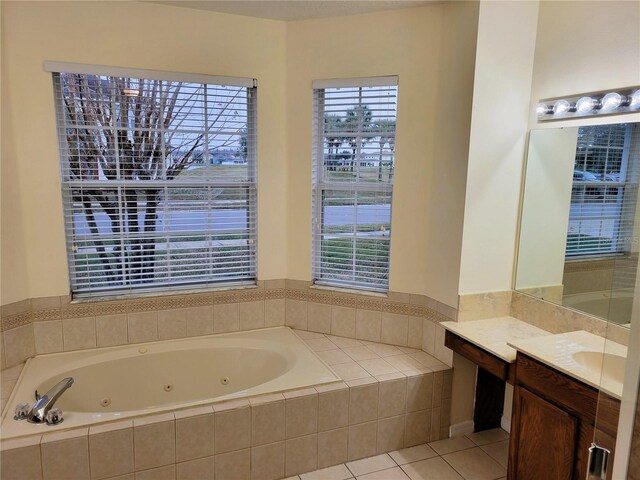 bathroom with vanity, tiled bath, and tile patterned floors