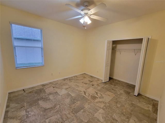 unfurnished bedroom featuring a closet and ceiling fan