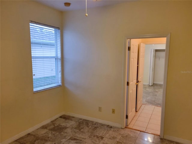 empty room featuring light tile patterned floors