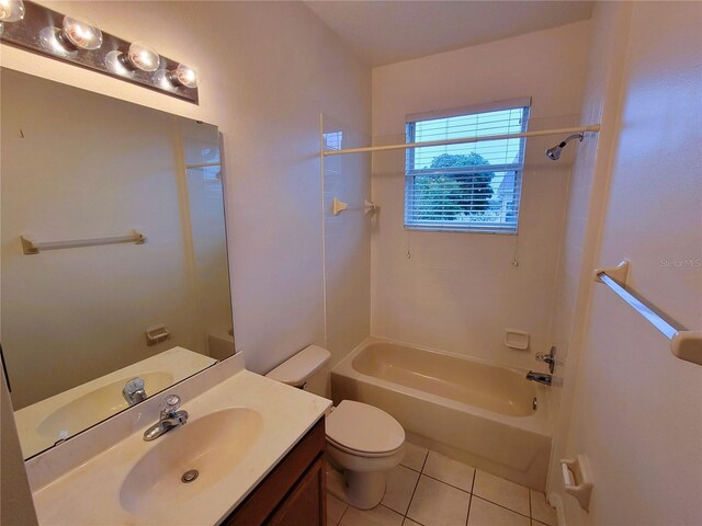 full bathroom with shower / tub combination, vanity, toilet, and tile patterned flooring