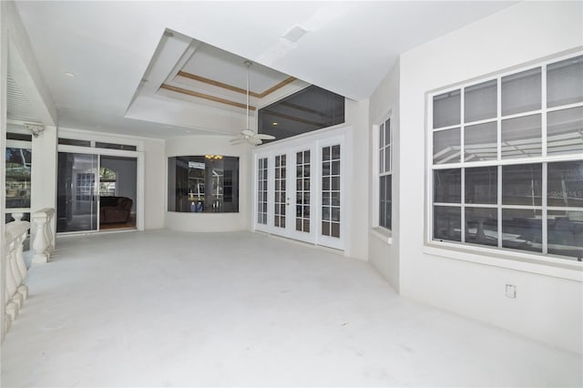 unfurnished sunroom with french doors and ceiling fan