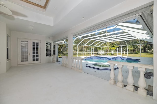 exterior space featuring french doors, an in ground hot tub, a lanai, and a patio