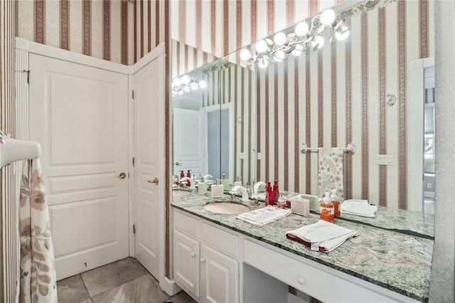 bathroom with tile patterned flooring and vanity