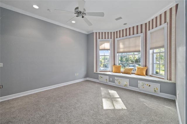 unfurnished room featuring ceiling fan, ornamental molding, and carpet flooring