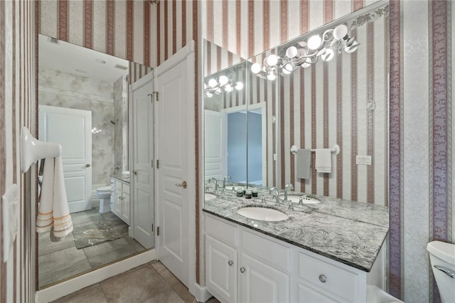 full bathroom featuring vanity, tile patterned floors, toilet, and shower / bath combination