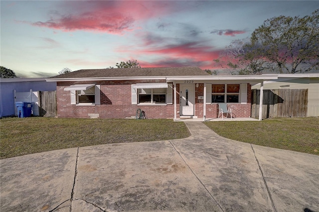 ranch-style house featuring a yard