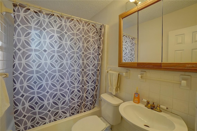 full bathroom with sink, tile walls, decorative backsplash, toilet, and a textured ceiling