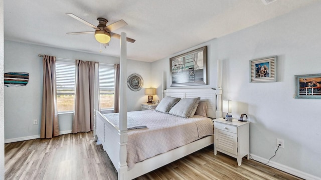 bedroom featuring light hardwood / wood-style floors and ceiling fan