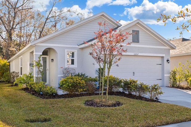 single story home with a garage and a front yard