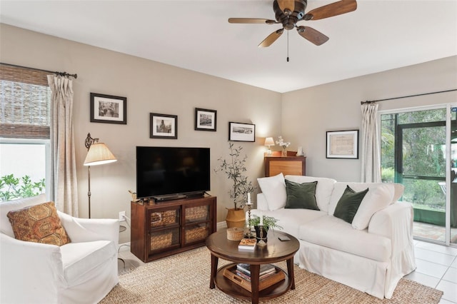 living room featuring ceiling fan and light tile patterned floors