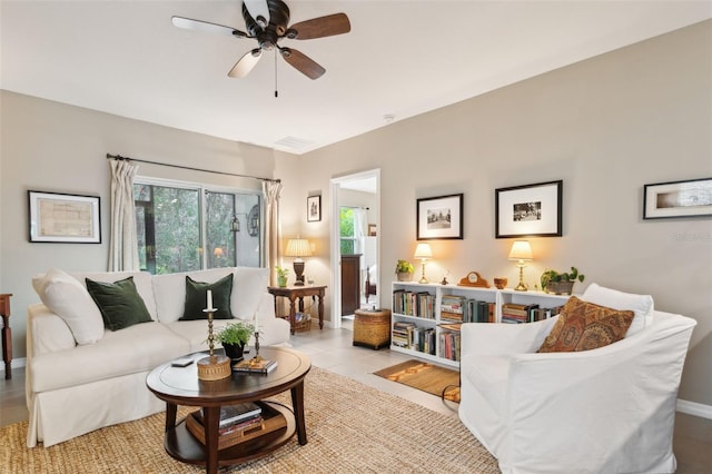 tiled living room featuring ceiling fan