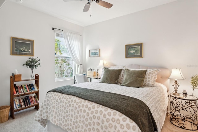 bedroom with light carpet and ceiling fan