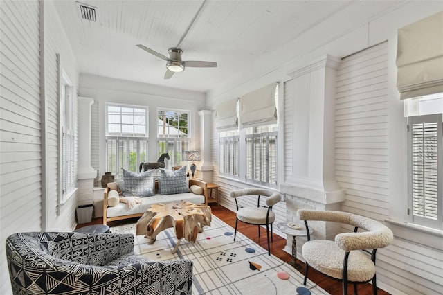 sunroom / solarium featuring ceiling fan