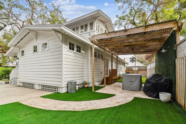 exterior space featuring a patio and a lawn