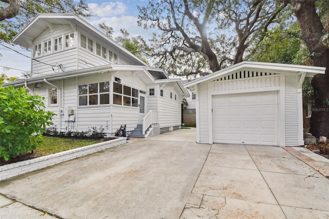 view of property exterior with a garage and an outdoor structure