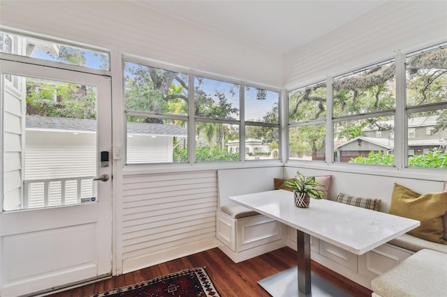 sunroom / solarium featuring breakfast area