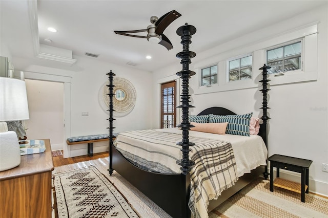 bedroom with wood-type flooring and ceiling fan