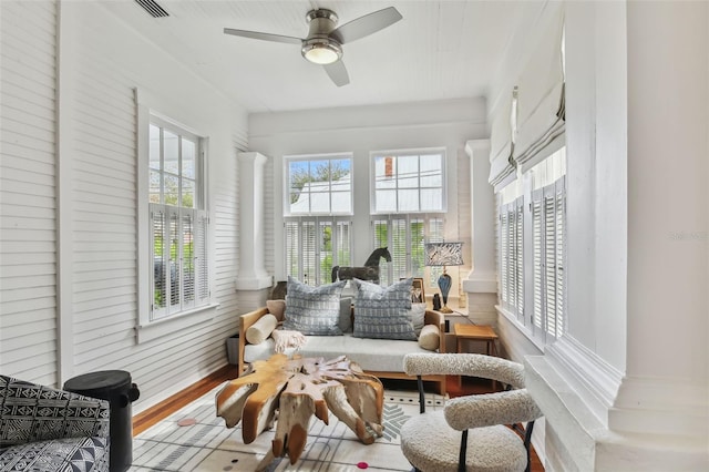 sunroom with ceiling fan