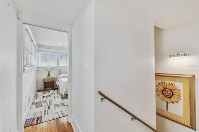 corridor featuring hardwood / wood-style floors