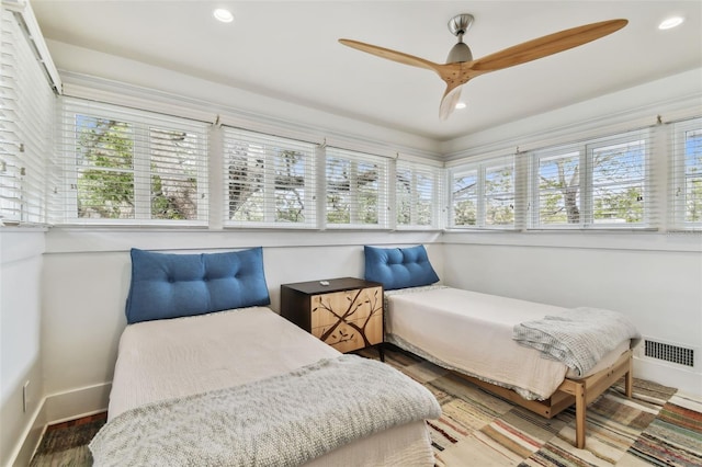 bedroom with hardwood / wood-style floors and ceiling fan