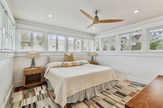 bedroom with hardwood / wood-style flooring and ceiling fan