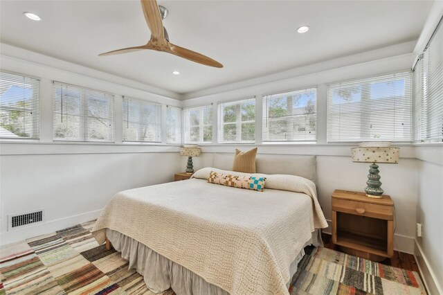 bedroom featuring wood-type flooring and ceiling fan