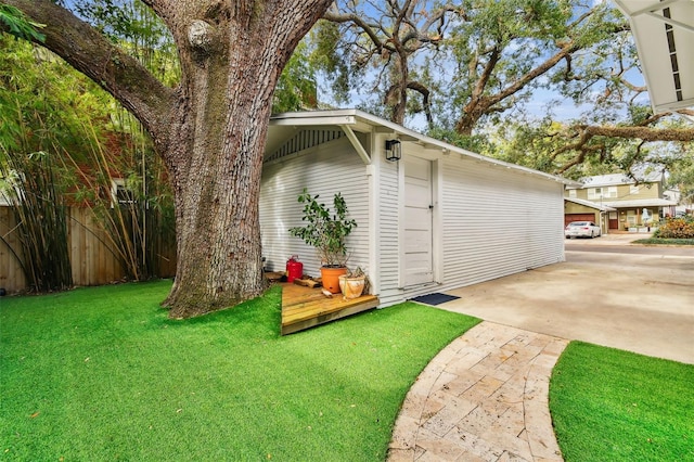 view of outbuilding with a lawn