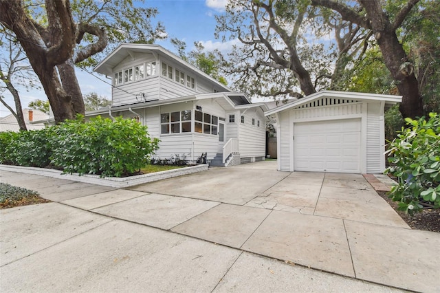 view of front property with a garage and an outdoor structure