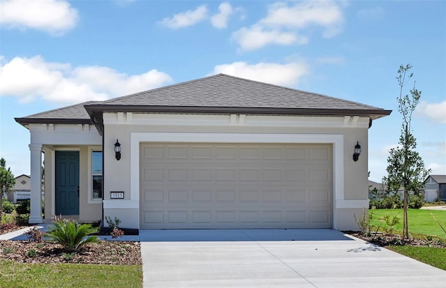 5915 SW 87th Ave, Ocala, FL 34481 - view of front facade featuring concrete driveway, a garage, stucco siding, and roof with shingles