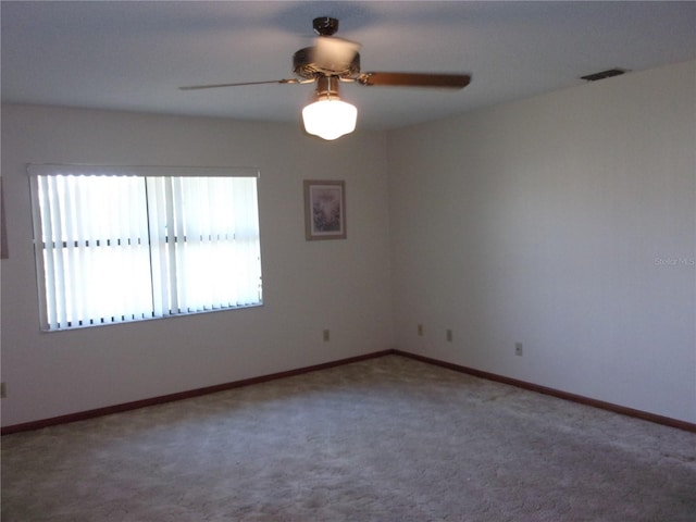 empty room with carpet floors and ceiling fan