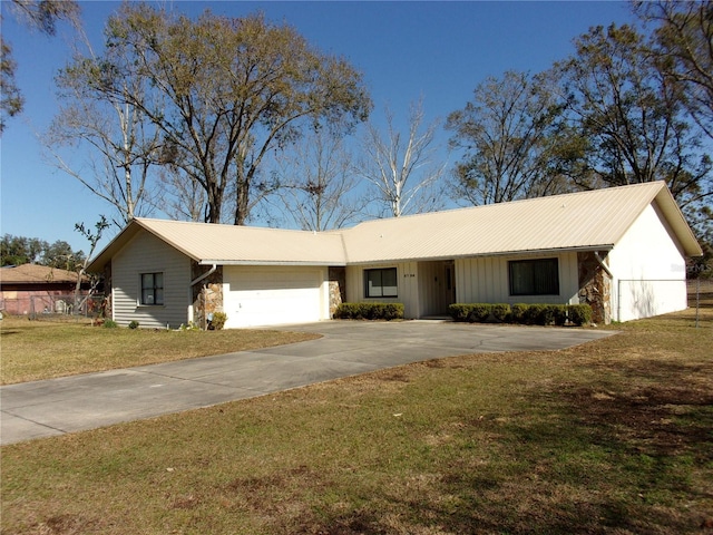 single story home with a garage and a front lawn