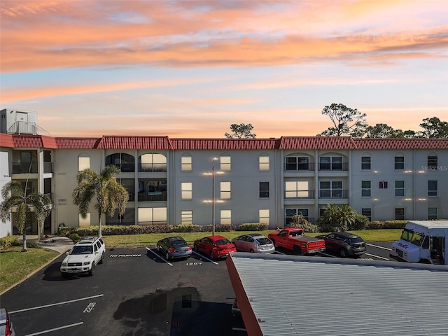 view of outdoor building at dusk