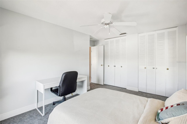 bedroom featuring multiple closets, ceiling fan, and carpet flooring