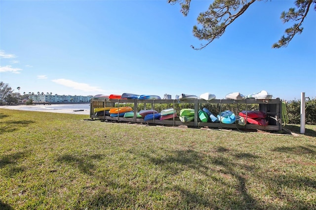 view of yard with a playground and a water view