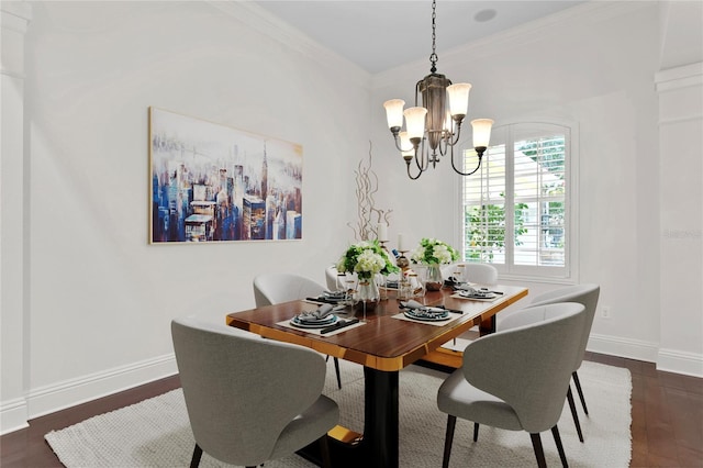 dining space featuring crown molding, dark hardwood / wood-style floors, and an inviting chandelier