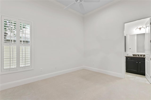 unfurnished room with crown molding, ceiling fan, and light carpet