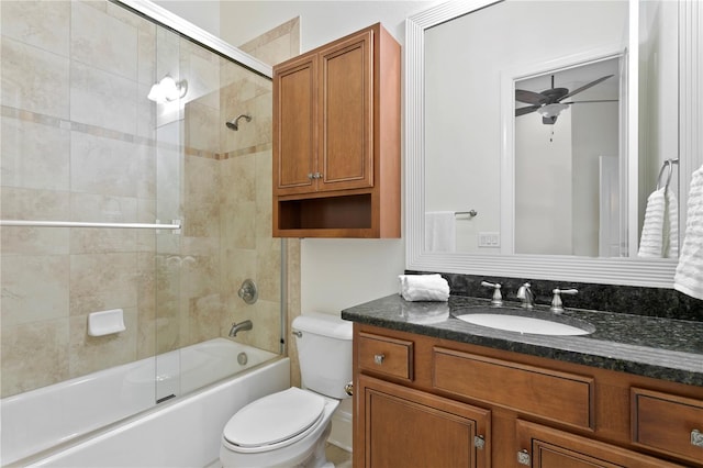 full bathroom with vanity, combined bath / shower with glass door, ceiling fan, and toilet