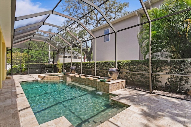 view of swimming pool with an in ground hot tub, a lanai, pool water feature, and a patio area