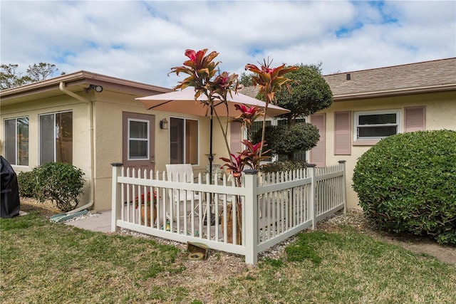 view of side of home featuring a yard