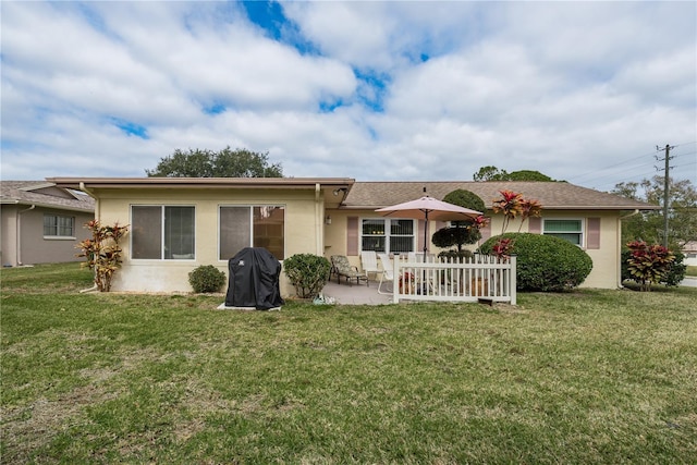 single story home with a patio area and a front yard