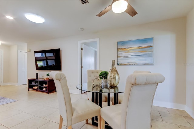 dining room featuring light tile patterned floors and ceiling fan