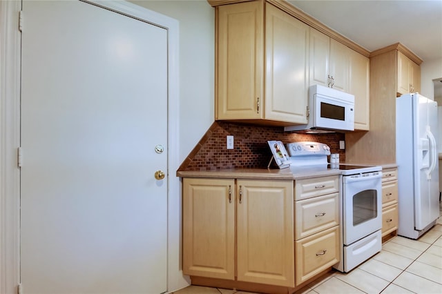 kitchen featuring light tile patterned floors, white appliances, and decorative backsplash