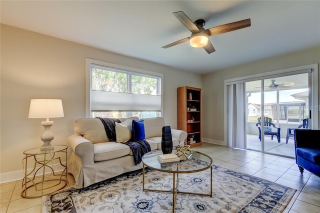 living room featuring light tile patterned floors and ceiling fan